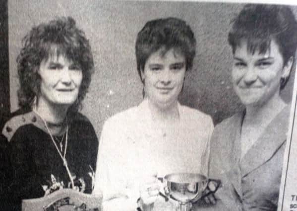 Tracy and Meg McGarry (left) winners of the Ladies' Pairs in the Larne Darts League pictured with runners-up Angela Irvine and Michelle Lamb. 1989.