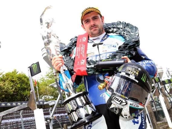Michael Dunlop with the Superbike trophy at last year's Isle of Man TT.