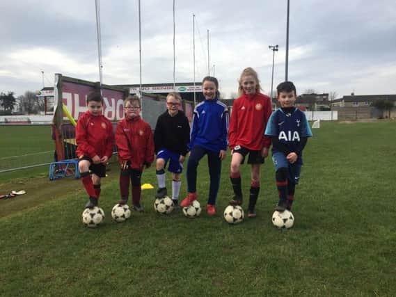 Children at Shamrock Park following the first-ever 'pop up' coaching camp organised by Portadown Football Club under community development officer Chris Wright.
