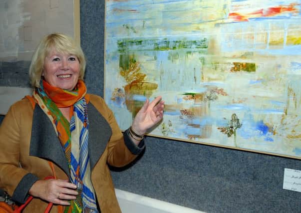 Jayne Jobling with her exhibit at a previous Larne Art Club exhibition. INLT 44-202-AM