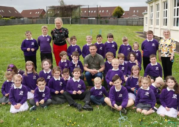 Carl Frampton pictured with staff and students at Mallusk Integrated Primary.