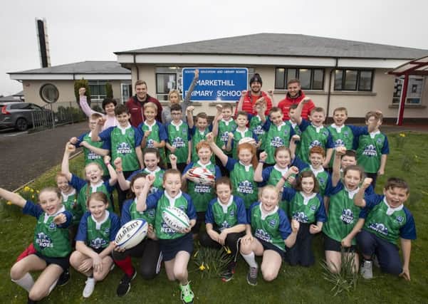 Markethill Primary School pupils enjoy a visit from Ulster Rugby players following success in the Dale Farm Building Heroes competition.