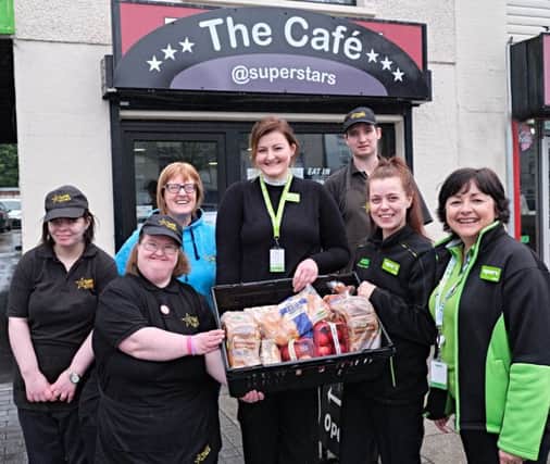 Handing over the food is ASDA Cookstown Community Champion Janice Gibson, Emer Devlin ASDA Cookstown Fresh Manger and Fionnula Morgan, Asda Cookstown Produce Section Leader, to May McAvoy, Chair of Superstars and cafe trainees Keith Wylie, Lynn Shaw and Nicola Hughes.