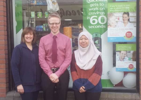 Staff pictured outside McCoubrey and Woodside's Pharmacy in Larne.