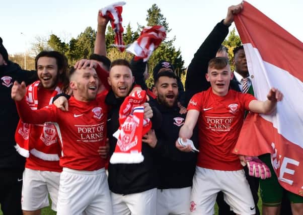 Larne celebrate after winning promotion after their win over Ballinamallard