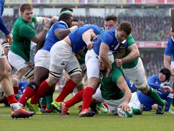 Ireland captain Rory Best goes over to score the opening try after two minutes against France.
