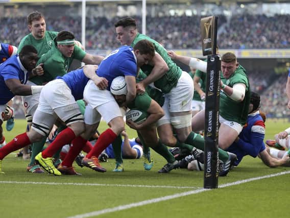 Ireland captain Rory Best crosses for the opening try against France