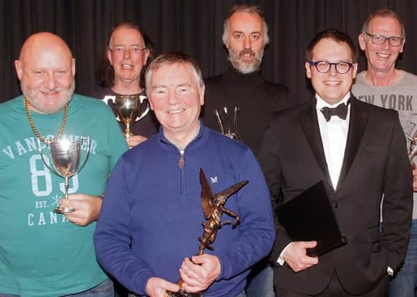 Back row (l to r), Donal O'Hanlon and Lowry Hodgett of Newpoint Players, joint winners of the best actor award; John Dobbin of Slemish Players, receiving the award for the most ambitious choice of play and on behalf of Savannah Bracewell the cup for best supporting actress; Ian McDonald receiving awards on behalf of himself and other members of Rosemary Drama Group for choreography, stage decor and the overall award for best comedy. Front row (l to r), Shane McCaffrey of Slemish Players with his award for best supporting actor; Sean Treanor of Newpoint Players receiving the award for best director; the Festival Adjudicator, Ben Humphrey; Alan Marshall receiving, on behalf of Jackie Wilson of Clarence players, the award for best actress.