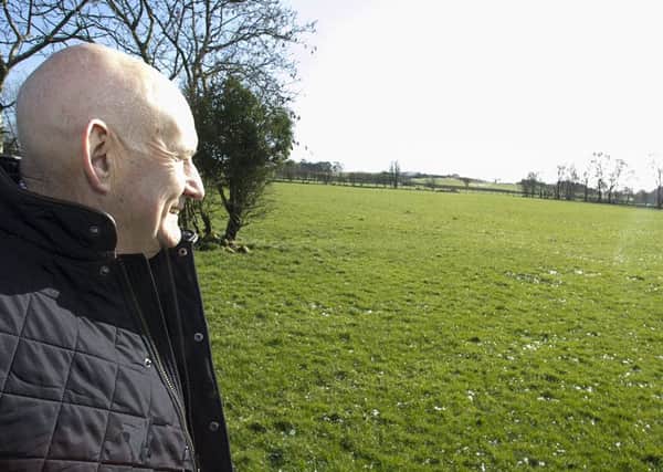 Alderman Robin Cherry pictured at the site which is to be purchased by Council for the provision a new cemetery.