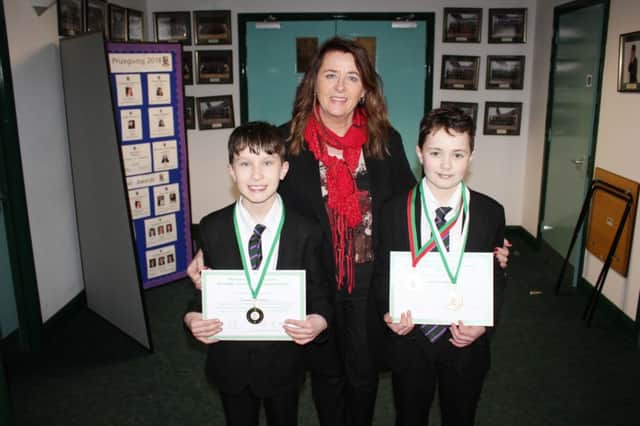 Charlie Lennon and Tom McSherry pictured with Anne AndersonNew-Bridge Principal.