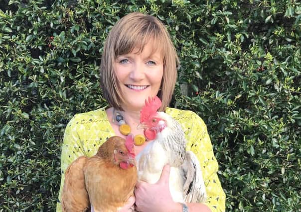 Lynne with two of her favourite chickens