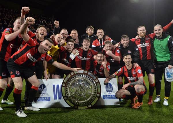 Crusaders celebrate success in the dramatic Toals County Antrim Shield final with a 4-3 win over Linfield. Pic by Pacemaker.