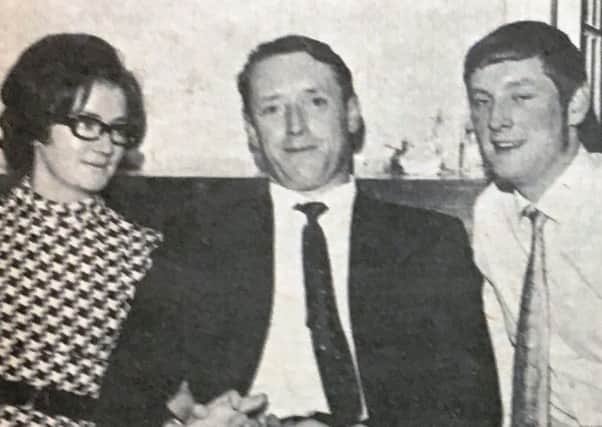 Sgt Fred Robinson and Mrs Robinson with Ian McManus at the Dunmurry RUC station dinner dance in 1970