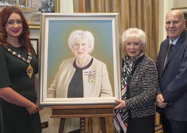 Lord Lieutenant Joan Christie CVO OBE is presented with her portrait by the Mayor of Mid and East Antrim, Cllr. Lindsay Millar and Cllr.Paul Reid.