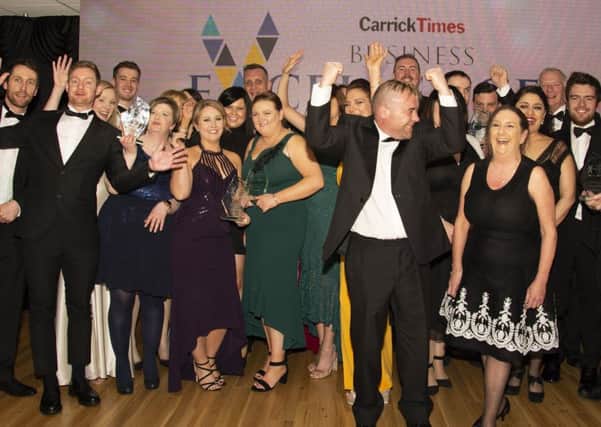 Some of the award winners at the Carrick Business Excellence Awards celebrate on the stage.
INCT11-19051BW