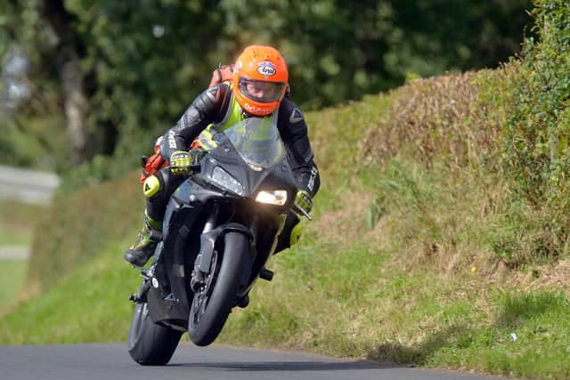 Dr John Hinds pictured on duty at the Mid Antrim 150 road races in 2013. The travelling doctor was just as well known as many of the riders he volunteered to provide care for as part of the MCUI Medical Team.