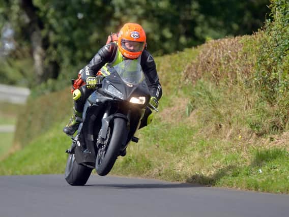 Dr John Hinds pictured on duty at the Mid Antrim 150 road races in 2013. The travelling doctor was just as well known as many of the riders he volunteered to provide care for as part of the MCUI Medical Team.