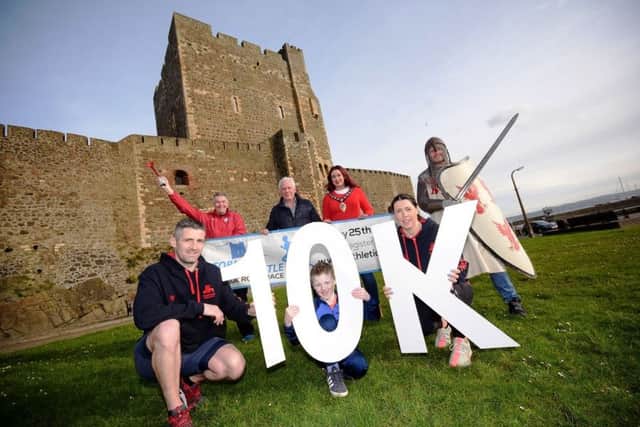At the Storming the Castle launch are, (back) from left to right, Andy Smyth, Jack Creighton, the Mayor, Cllr Lindsay Millar and Neill Harper, Seapark AC; (front) Jack, Caroline and James Wasson (middle).