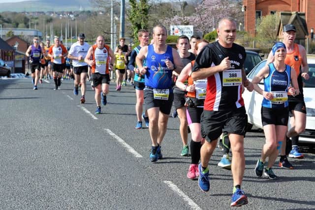 Runner No 388, Thompson Crawford makes his way along Victoria Road. INLT 11-003-PSB