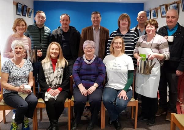 Paul Girvan MP and Trevor Clarke MLA pictured with members of Tildarg Cultural Society and a representative of the Mae Murray Foundation.