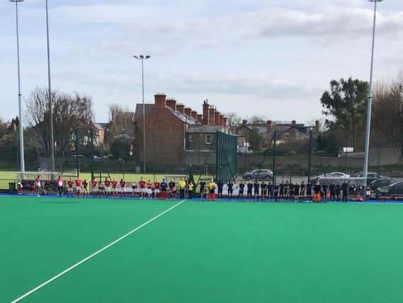 Cookstown and Pembroke players observe a  one minute silence before their EY Hockey League fixture on Saturday in memory of the victims of the Greenvale Hotel tragedy on St Patrick's Day.