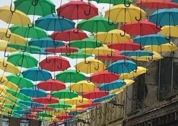 Umbrellas have been suspended at Dunluce Street. Pic by Una Gorman.