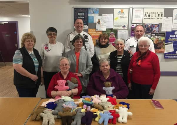 CI Stephen Humphries and Sergeant Stephen Rainey pictured with members of the Ballee Community Centre knitting club.