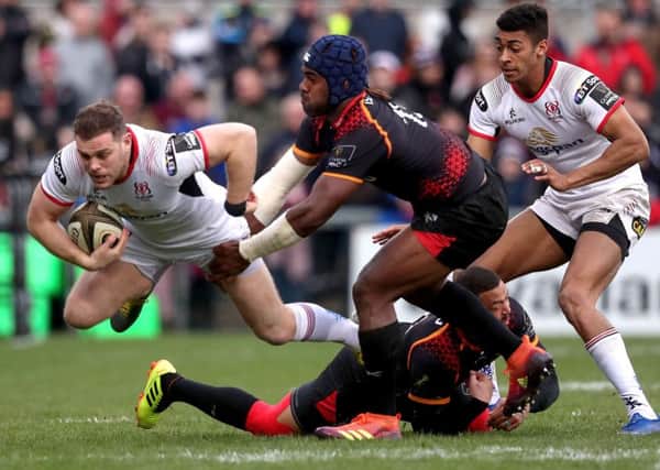 Ulster's Darren Cave is tackled by Meli Rokoua and Bjorn Basson of Southern Kings