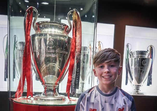 Trophy time for Cullybackey College pupil Luke who was one of 41 boys from the school who took part on a weekend trip to North West England to visit both Manchester City FC and Liverpool FC.