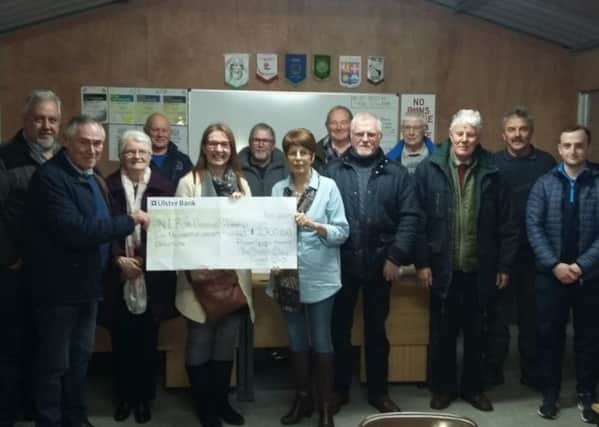 The Thatch Clay Target Club present Rhoda Walker, Chair of the Northern Ireland Rare Disease Partnership with a cheque for £2700 raised at their recent Richard Marshall Memorial Shoot.