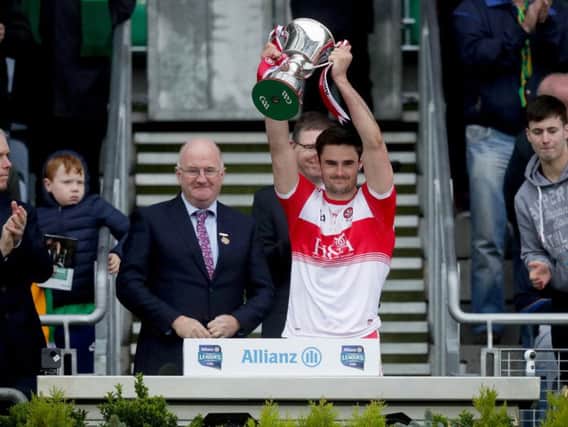 Derry captain Christopher McKaigue lifts the Division Four trophy after their victory over Leitrim in Croke Park.