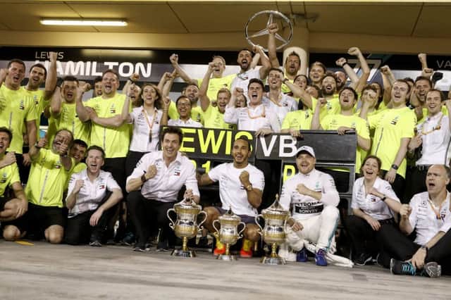 Lewis Hamilton and Valtteri Bottas celebrate with the rest of the Mercedes AMG Petronas team after Sunday's Bahrain Grand success. Photo: Wolfgang Wilhelm
