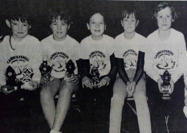 Coach Pat Evans pictured with her Carrickfergus Leisure Centre team who came second in the Belfast Open Trampoline Competition. 1989