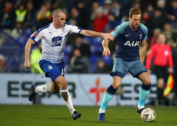 Luke McCullough (left) up against Harry Kane during Tranmere Rovers' FA Cup clash with Tottenham Hotspur in January. Pic by Getty Images.