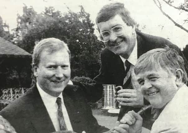 Robin Gill won Portadown Rotary Club's Harry Lauder trophy in 1993. He was presented with the trophy by Clive Henning and Bryan Mortimer