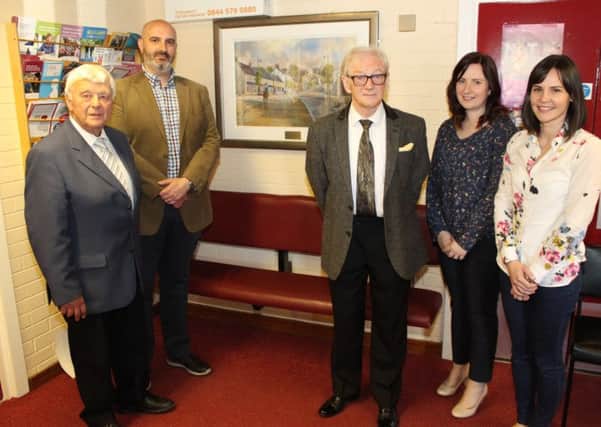 At the presentation of a painting of Richhill to the village's health centre are Dr Alan Turtle, Dr Dan Murtagh, Mr Richard Jennett, Dr Leanne Bruce and Dr Allison Menary. The picture was presented by Mr Jennett in memory of his late wife June.