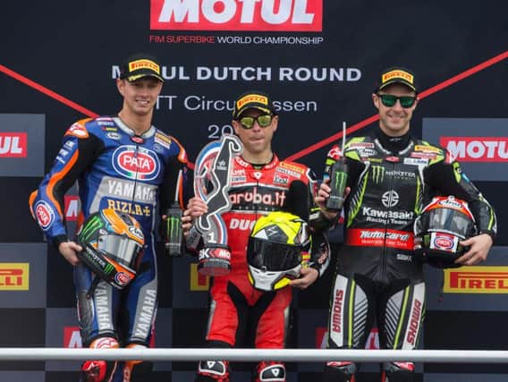Jonathan Rea on the rostrum with Alvaro Bautista (centre) and Michael van der Mark after race two at Assen on Sunday.