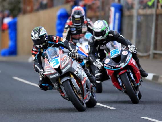 Michael Dunlop leads Adam McLean and Derek Sheils in the Supersport race at the Cookstown 100 in 2018.