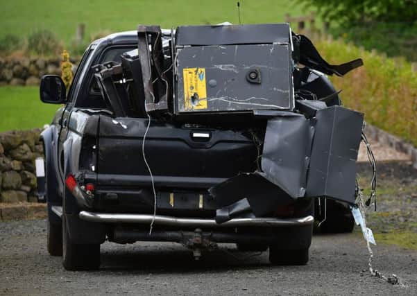 The pick-up vehicle and stolen cash machines were abandoned at Woodside Road. Pic: Colm Lenaghan/Pacemaker