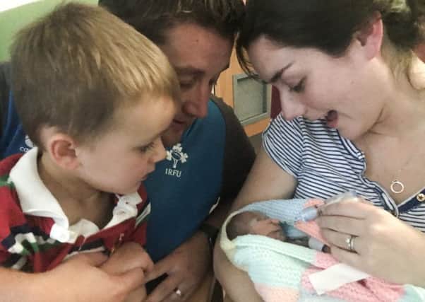 The family together less than half an hour before Hannah passed away at just eight days old