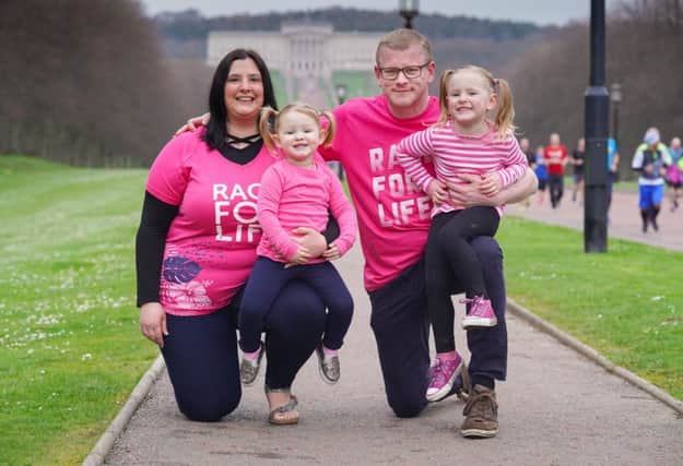 Banbridge photographer Gary Crossan will take part in Cancer Research UKs Race for Life at Stormont Estate on Sunday May 26, marking one year since finishing his treatment for bowel cancer. He will be joined by his wife Julie and daughters Rowen, four, and two-year-old Reesa who was only a few months old when he became ill in 2017.  Picture: Aaron McCracken