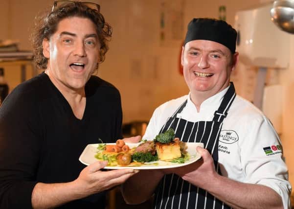 Singer songwriter Brian Kennedy and Kevin Osborne, head chef of Ballygally Castle Hotel, promote the cookery food demos which will be held as part of the Friends Goodwill Music Festival,