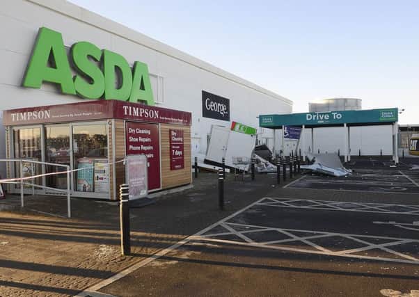 The two ATMs were ripped from a wall at an Asda supermarket in Antrim in February