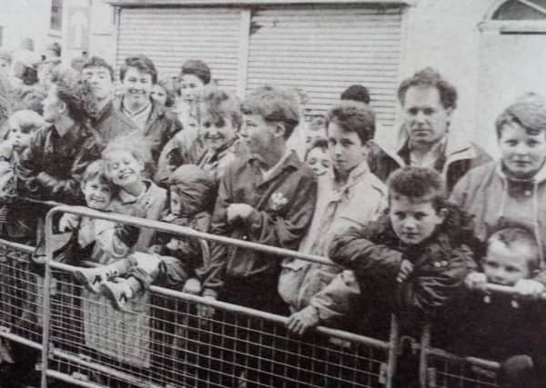 A section of the crowd who waited for the appearance of Glasgow Rangers' Ally McCoist at the Village Sports Shop in Carrickfergus. 1991