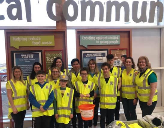 Friends of New-Bridge pictured with the SEN department in New-Bridge Integrated College at a recent bag pack in Tesco