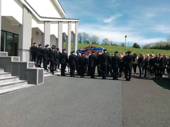 Colleagues at Magherafelt Fire Station formed a guard of honour as Mr Brown's remains were carried into the church.