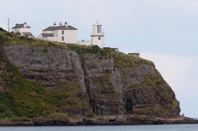 Blackhead lighthouse sits majestically on top of the cliff face   CT37-476RM