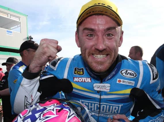Fermanagh man Lee Johnston celebrates his Supersport victory at the North West 200.