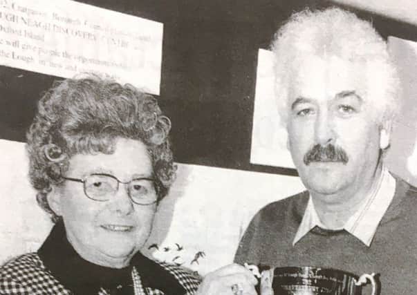 Miss Nina Murdoch presents the Shaftesbury Cup to Errol Bailie in 1992 to be competed for at a clay pigeon shoot in aid of Lough Neagh Rescue Service