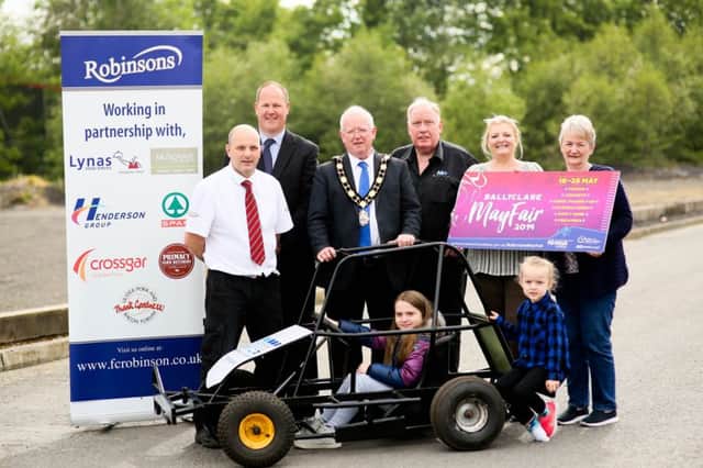 The Mayor of Antrim and Newtownabbey, Alderman John Smyth, is joined by Aidan Wilson from Robinsons; Ross McCowan, Ross Joint; Michael Workman, MW Tyres; Alderman Mandy Girvan, Valerie Jenkins and children to launch Ballyclare May Fair.